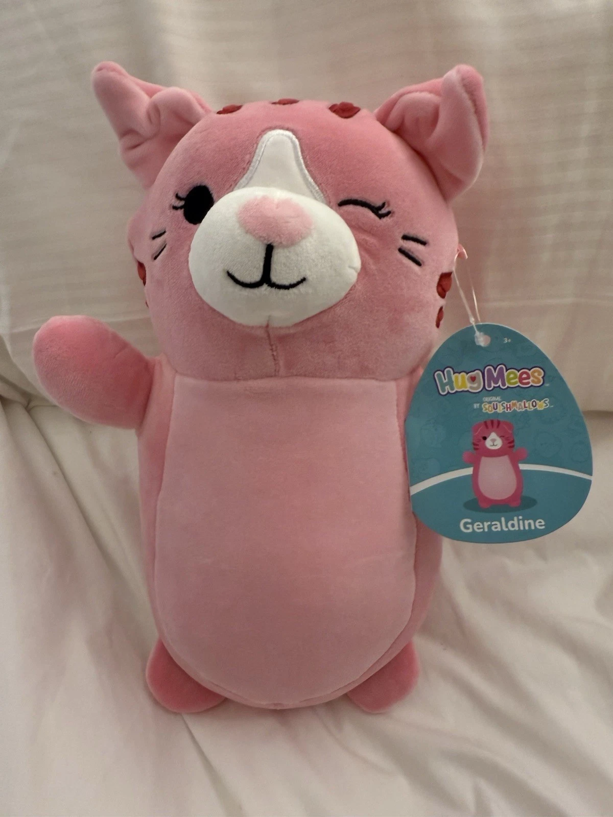 NEW Squishmallows HugMees 10” Inch Geraldine the Pink Tabby Cat Kitty Winking